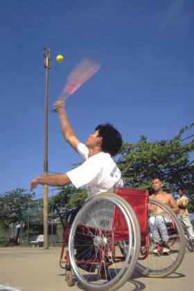 Man playing wheelchair tennis, Cambodia
